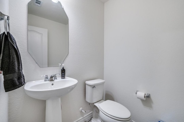 1016 Webb Ave, Aubrey, TX 76227 - bathroom with a sink, toilet, and visible vents