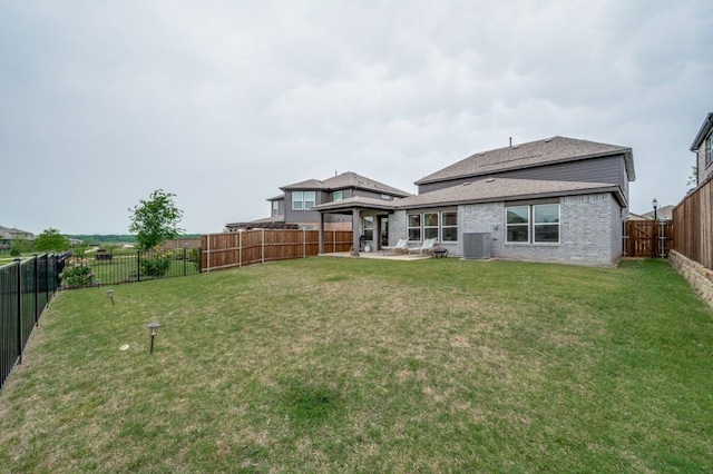 1016 Webb Ave, Aubrey, TX 76227 - rear view of property featuring a fenced backyard, a lawn, central AC, and brick siding