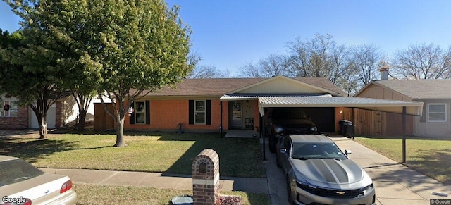 ranch-style home with a carport, concrete driveway, a front lawn, and brick siding