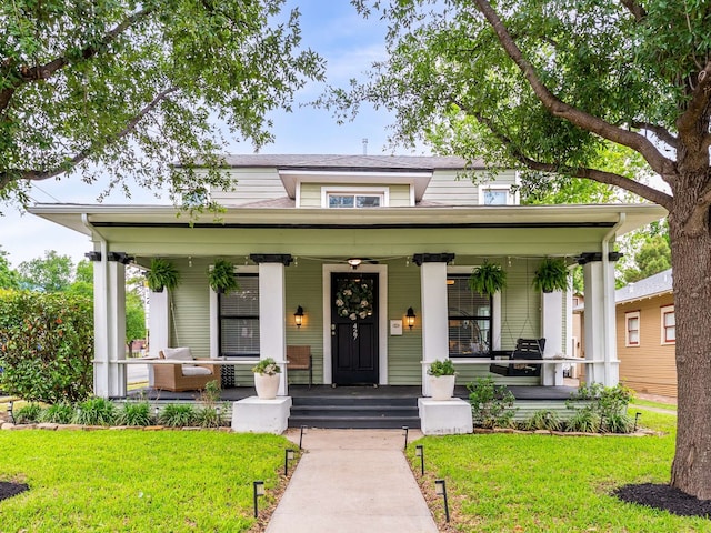 bungalow-style house featuring a porch and a front yard