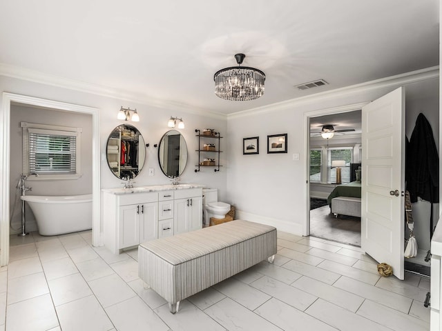 ensuite bathroom with a sink, visible vents, a wealth of natural light, and ensuite bath