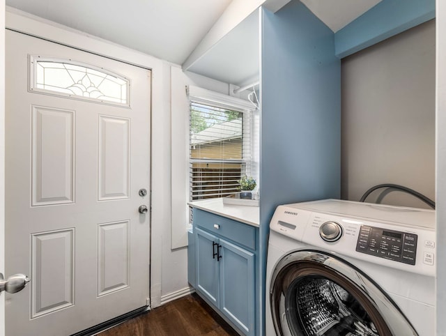 laundry room featuring washer / dryer, dark wood-style flooring, and cabinet space
