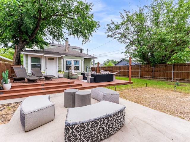 view of patio featuring an outdoor living space, a fenced backyard, and a wooden deck
