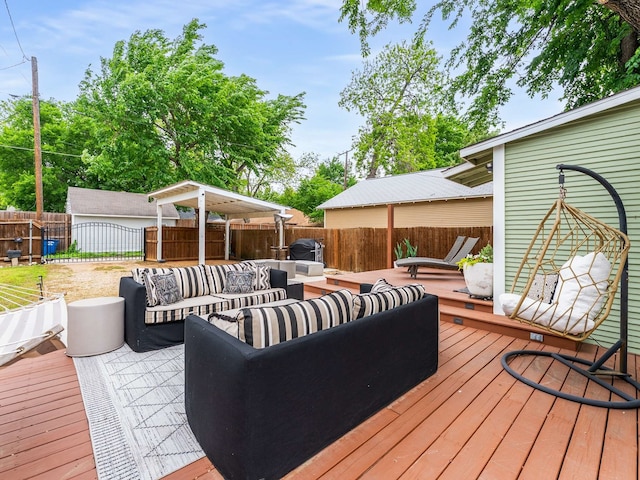 wooden terrace with outdoor lounge area and a fenced backyard