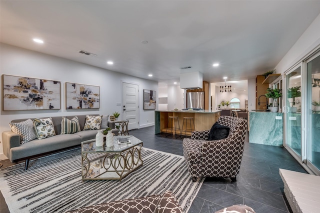 living room featuring visible vents and recessed lighting