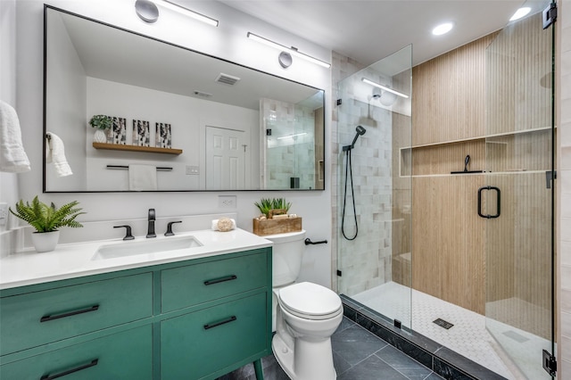full bath with visible vents, a shower stall, vanity, tile patterned floors, and toilet
