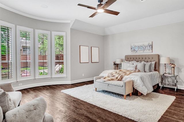 bedroom with dark wood-style flooring, baseboards, and a ceiling fan