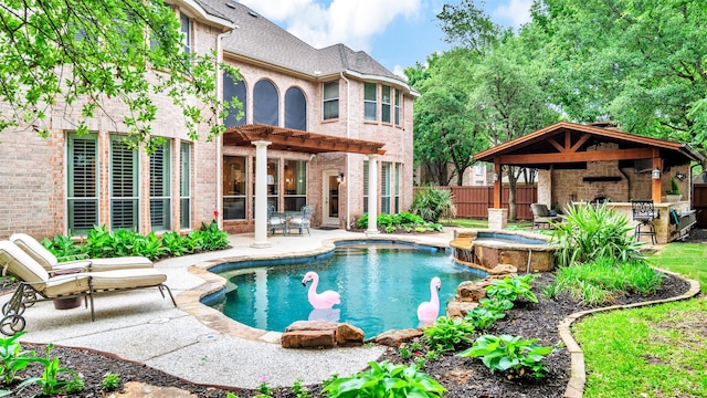 view of swimming pool with outdoor dry bar, a patio area, a gazebo, fence, and a pergola