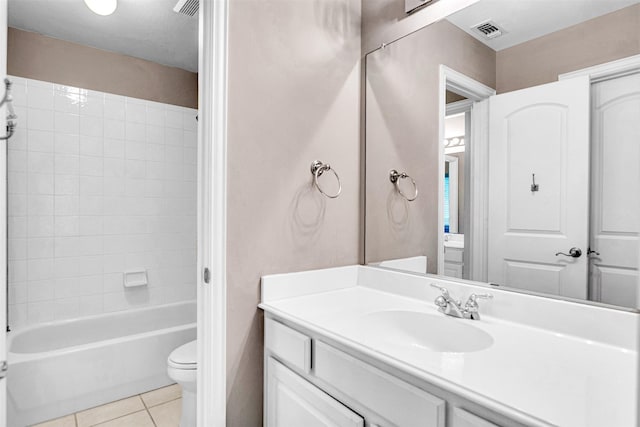 full bathroom featuring shower / bathing tub combination, visible vents, tile patterned flooring, vanity, and toilet