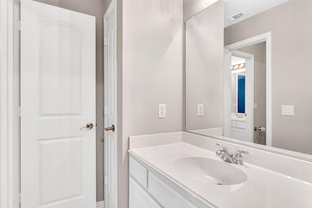 bathroom featuring vanity and visible vents