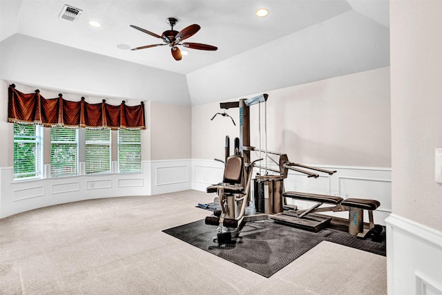 workout room featuring visible vents, a decorative wall, ceiling fan, a wainscoted wall, and carpet