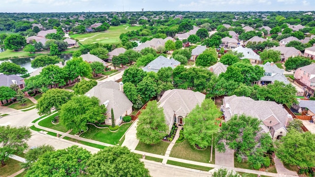 aerial view with golf course view and a residential view