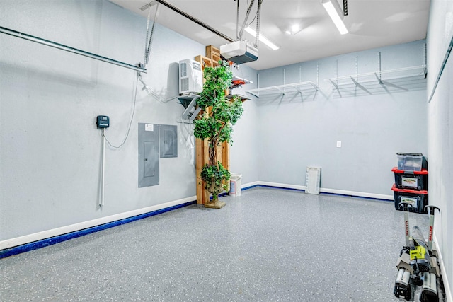 garage with baseboards, a garage door opener, and electric panel
