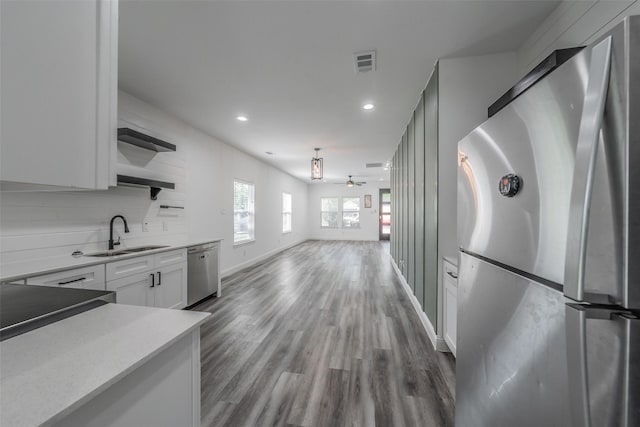 kitchen with visible vents, open shelves, recessed lighting, a sink, and appliances with stainless steel finishes