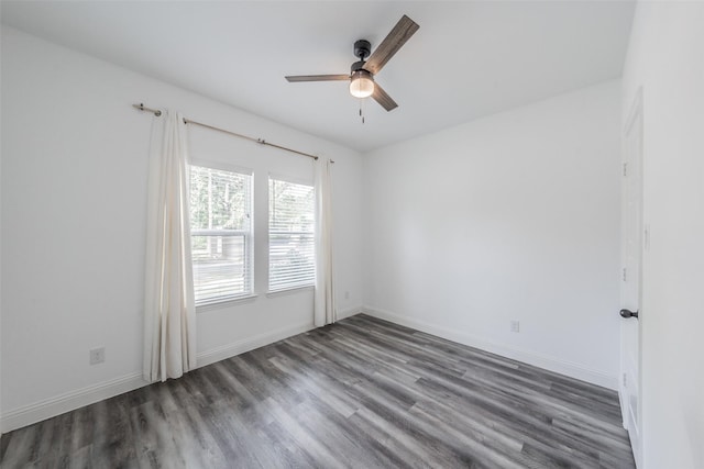 empty room with baseboards, a ceiling fan, and wood finished floors
