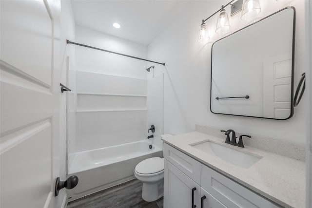 full bath featuring vanity, wood finished floors, toilet, recessed lighting, and shower / tub combination
