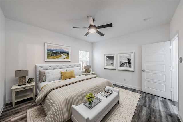 bedroom featuring baseboards, a ceiling fan, and dark wood finished floors