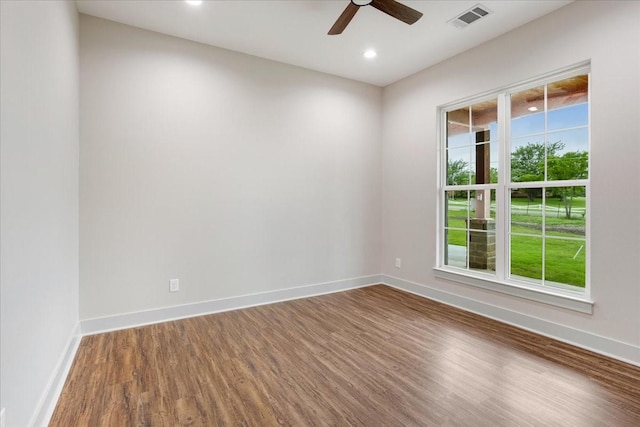 unfurnished room with visible vents, baseboards, recessed lighting, a ceiling fan, and dark wood finished floors