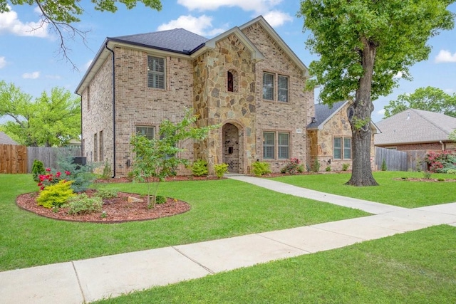 805 S Lindsay St, Gainesville, TX 76240 - view of front of home with stone siding and brick siding