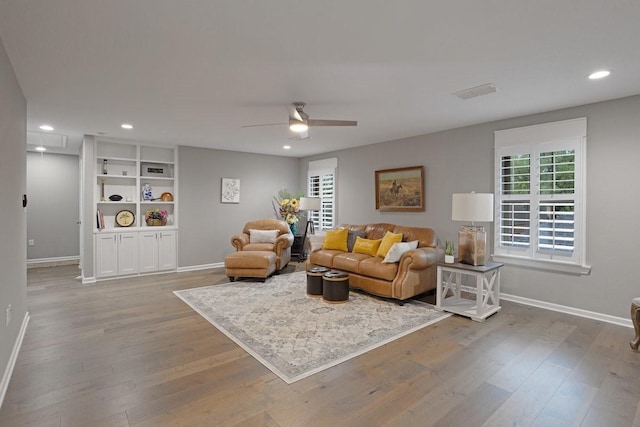 805 S Lindsay St, Gainesville, TX 76240 - living area featuring baseboards, healthy amount of natural light, wood finished floors, recessed lighting, and ceiling fan