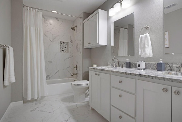 805 S Lindsay St, Gainesville, TX 76240 - bathroom with marble look tiles, toilet, shower / bath combo, and double vanity