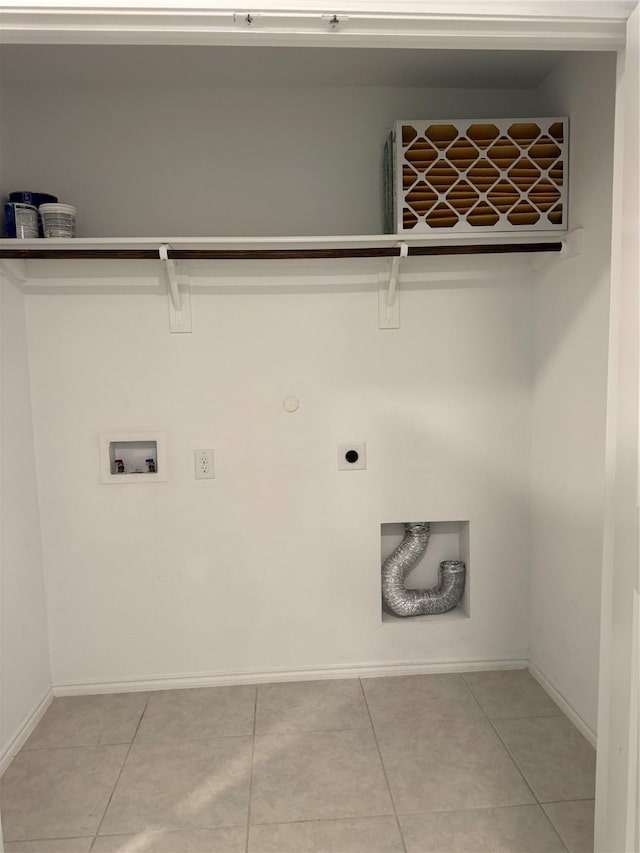 washroom with light tile patterned floors, baseboards, laundry area, and electric dryer hookup