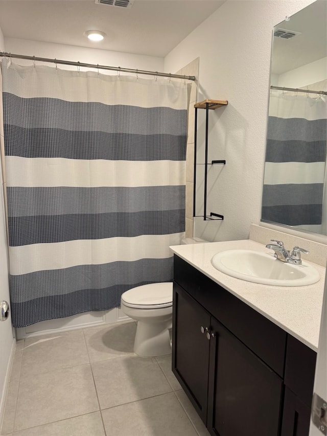 bathroom featuring visible vents, curtained shower, tile patterned floors, vanity, and toilet