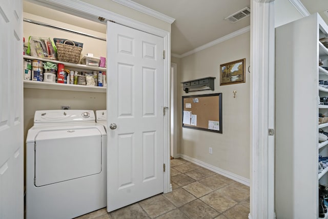 clothes washing area with laundry area, visible vents, crown molding, baseboards, and washer and dryer