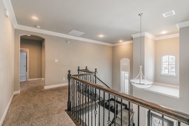 1310 Packsaddle Trl, Prosper, TX 75078 - hallway with crown molding, arched walkways, baseboards, carpet floors, and an upstairs landing