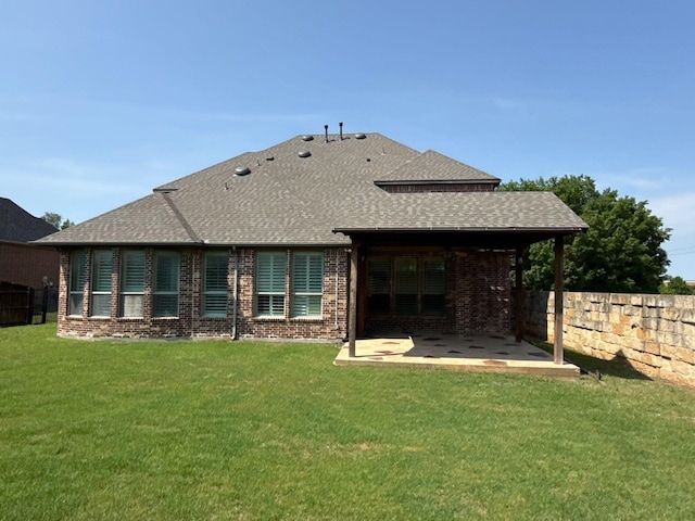 1310 Packsaddle Trl, Prosper, TX 75078 - back of house featuring a patio, a fenced backyard, brick siding, and a shingled roof