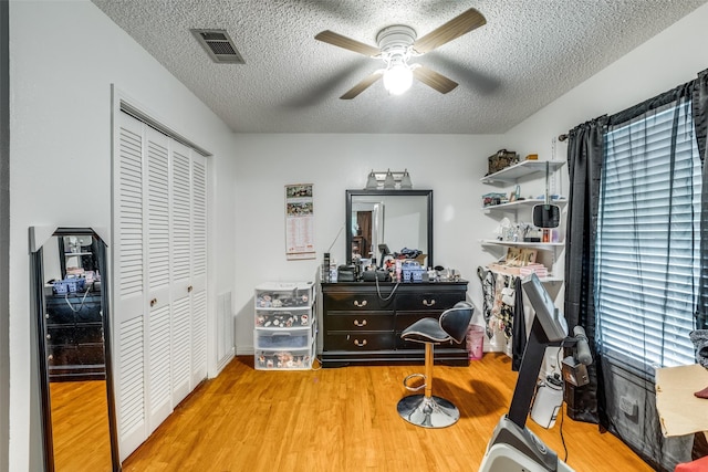 1813 Brook Hollow Dr, Fort Worth, TX 76114 - office area with visible vents, a textured ceiling, ceiling fan, and light wood-type flooring