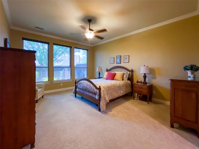 bedroom with baseboards, ornamental molding, light carpet, and visible vents