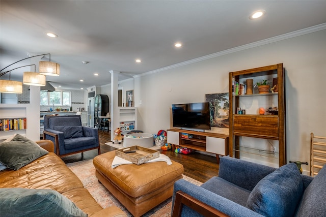 living area with crown molding, recessed lighting, and wood finished floors