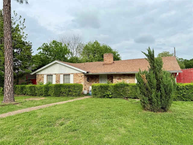321 Chisholm Trl, Sherman, TX 75092 - ranch-style home featuring roof with shingles, a chimney, a front yard, and brick siding