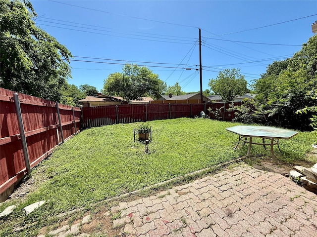 321 Chisholm Trl, Sherman, TX 75092 - view of yard with a fenced backyard and a patio