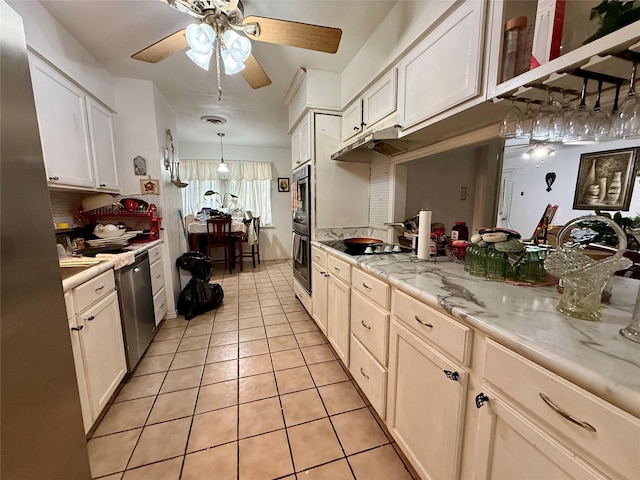 321 Chisholm Trl, Sherman, TX 75092 - kitchen with dobule oven black, light tile patterned flooring, ceiling fan, backsplash, and dishwasher