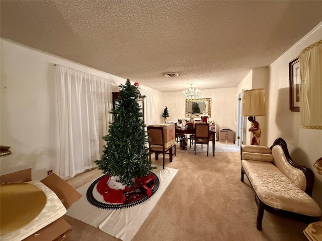 321 Chisholm Trl, Sherman, TX 75092 - sitting room with light colored carpet, a textured ceiling, an inviting chandelier, and visible vents