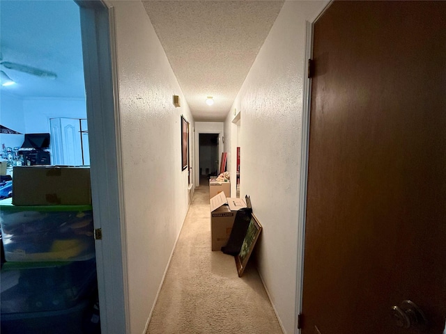 321 Chisholm Trl, Sherman, TX 75092 - hall featuring a textured ceiling, a textured wall, baseboards, and carpet