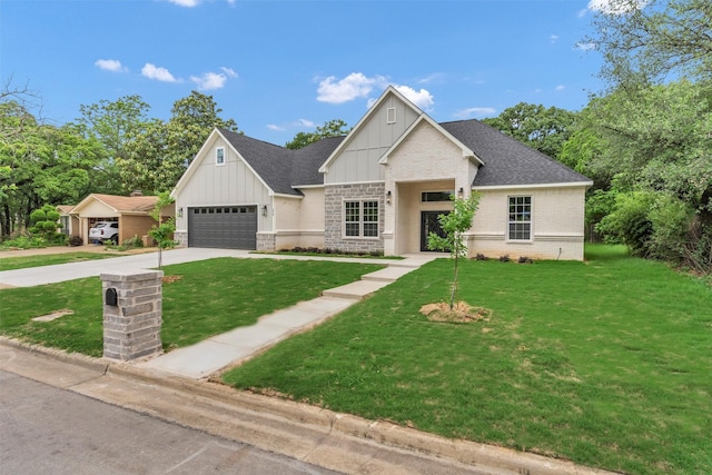 view of front of house featuring roof with shingles, a garage, board and batten siding, a front yard, and concrete driveway