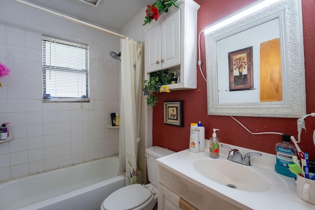 bathroom featuring shower / bath combo with shower curtain, toilet, and vanity