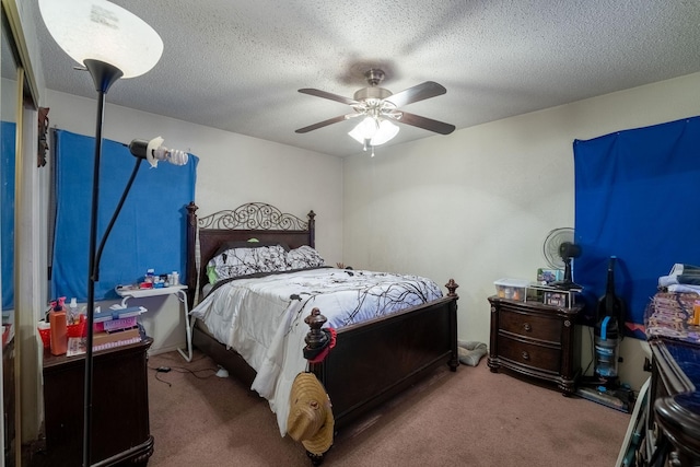 carpeted bedroom with a textured ceiling and ceiling fan