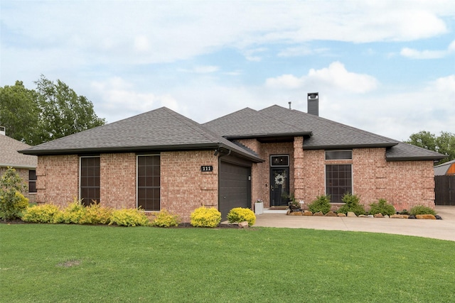 view of front of home with brick siding, a garage, a chimney, and concrete driveway
