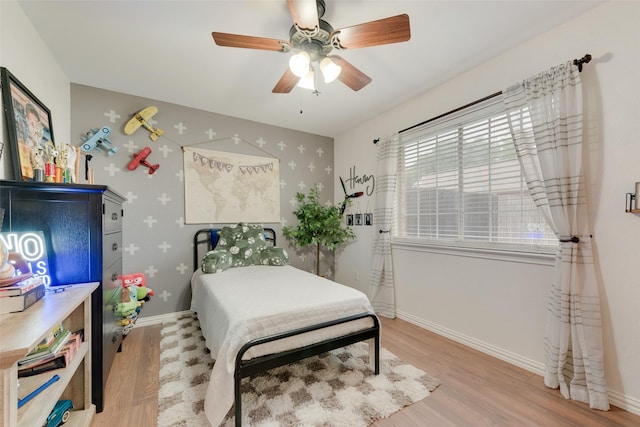 111 Princeton Cir, Forney, TX 75126 - bedroom with baseboards, ceiling fan, and light wood-style floors