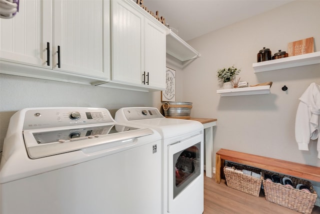 111 Princeton Cir, Forney, TX 75126 - washroom featuring cabinet space, washing machine and dryer, and wood finished floors