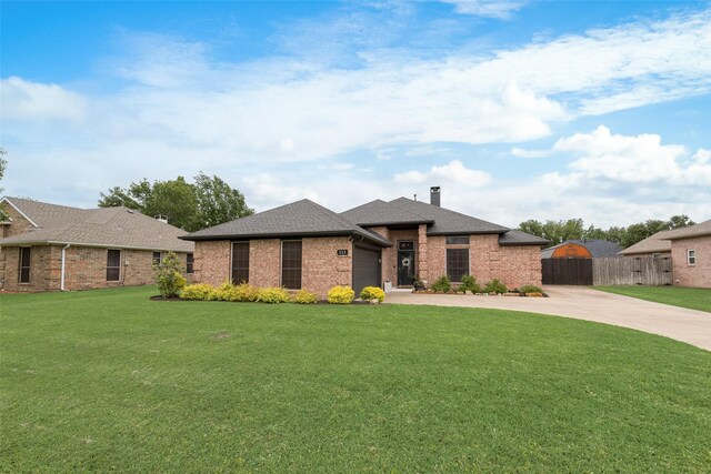 111 Princeton Cir, Forney, TX 75126 - view of front of home with a garage, a chimney, concrete driveway, and a front lawn
