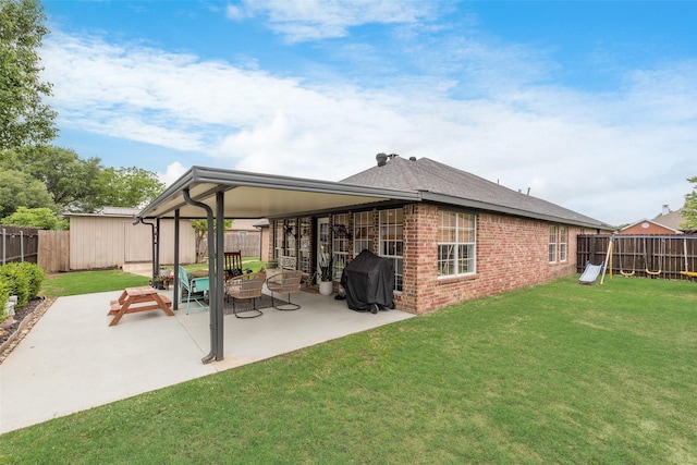 111 Princeton Cir, Forney, TX 75126 - rear view of house with brick siding, a fenced backyard, a patio area, and a yard