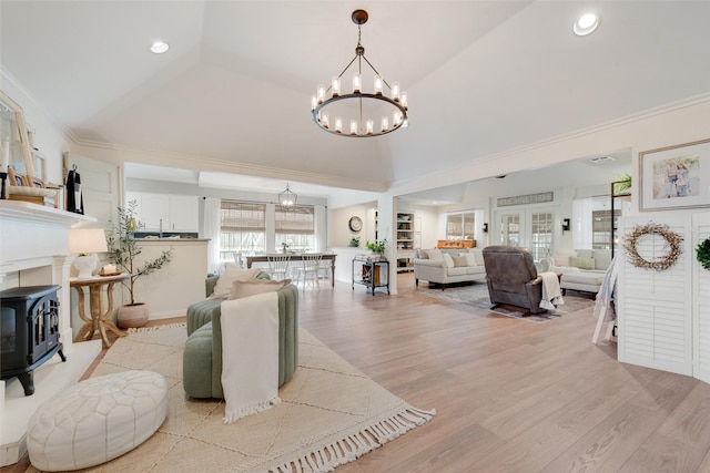 111 Princeton Cir, Forney, TX 75126 - living area featuring recessed lighting, a wood stove, light wood finished floors, and a chandelier