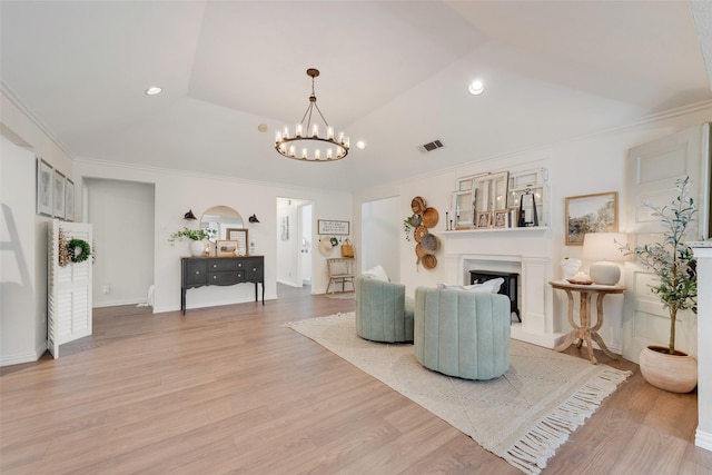 111 Princeton Cir, Forney, TX 75126 - living room with an inviting chandelier, light wood finished floors, a fireplace with raised hearth, recessed lighting, and visible vents