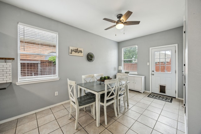 10602 Greenbriar Ln, Rowlett, TX 75089 - dining room with light tile patterned flooring, ceiling fan, and baseboards