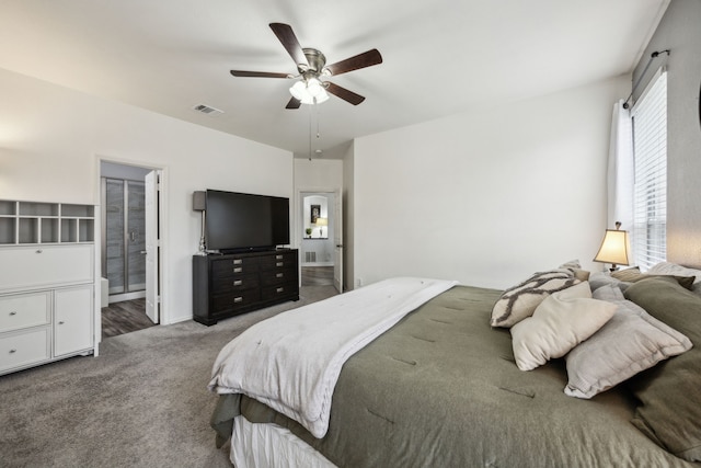 10602 Greenbriar Ln, Rowlett, TX 75089 - bedroom with carpet floors, a ceiling fan, visible vents, and ensuite bath